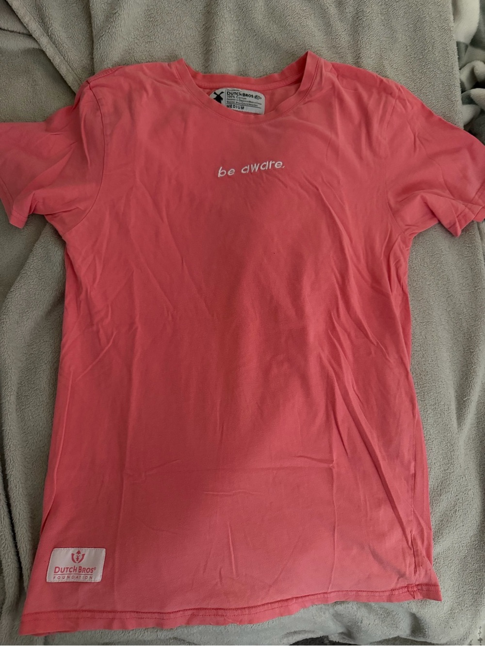 Dutch Bros Coral Pink "be aware." Short Sleeve Tee
